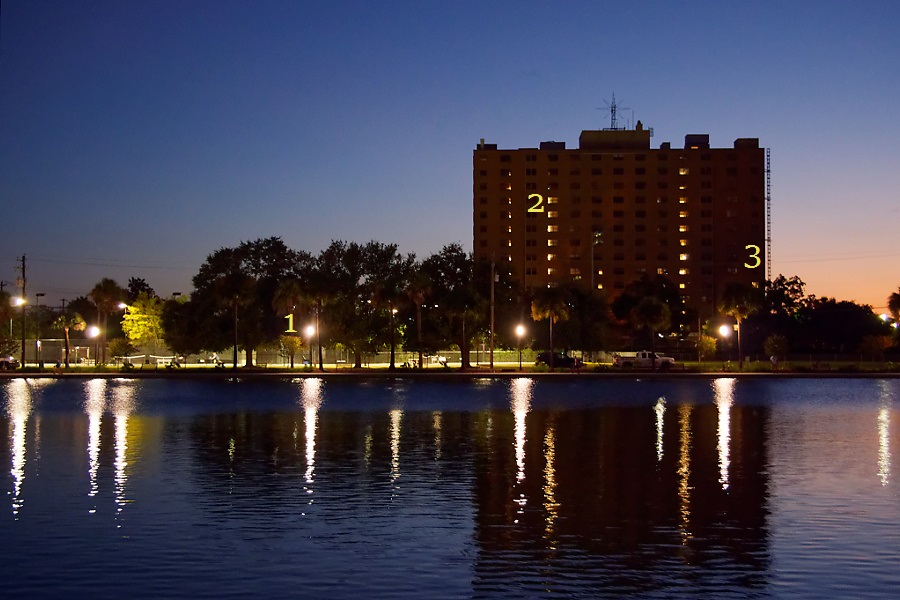 An example scene illustrating 3 desirable features to set autofocus with when faced with low light: (1) a direct lighting source, (2) an indirect lighting source, and (3) a sharp contrast (the edge of the building).