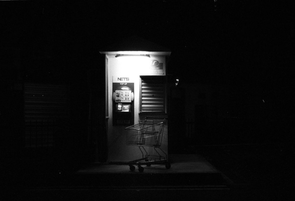Little India, Singapore. There’s something about this photo that’s beautifully creepy. The light reflects off the booth and softens it up for the pushcart, framing everything nicely. I walked up to meter the scene off the grey metal shutters on the right, then closed down a stop for good measure. The negative I got was quite thin, but my scanner did a good job pulling out the details where it mattered.